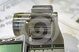 Measuring gears with a caliper in production, high-precision machining