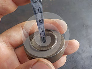measuring the hole size of a spay nozzle