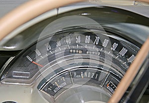 Measuring instruments in a retro car with arrows.