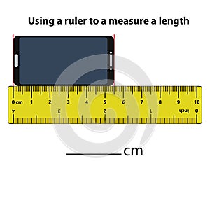 Measuring length in centimeters mobile phone and calculator with the ruler.