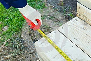 Measuring the length with a construction tape