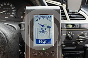 Measuring the magnetic field in a car using an electromagnetic field measuring tool, EMF meter