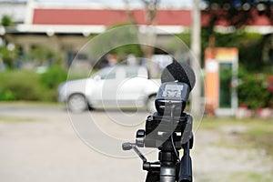 Measuring the noise on the road with a sound level meter.