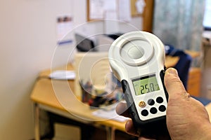 Measuring office lighting with lux meter