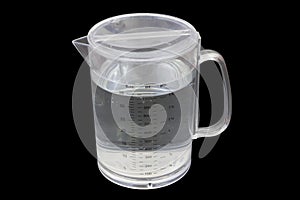 Measuring plastic jug full on black background with cipping path