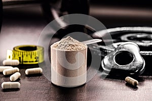 Measuring Spoon with Creatine or Whey, Food Supplement, Casein Cocktail, Muscle Mass Vitamin, Plated, Bodybuilding Concept