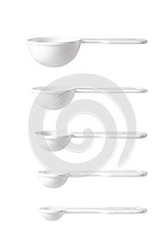 White measuring spoons isolated on a while background