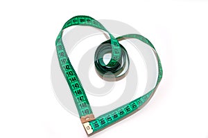 Measuring tape looking as heart isolated over white