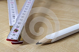 Measuring tape meter and pensil. Construction tools. photo