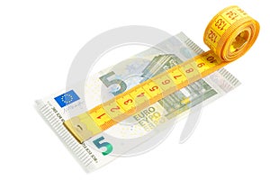 Measuring tape on new five euro banknote photo