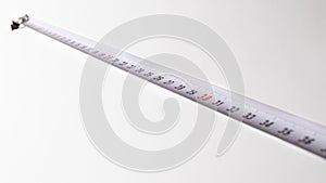 Measuring tape with numbers centimeters on a white background.