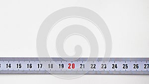 Measuring tape with numbers centimeters on a white background. Construction tools. Banner with place for text