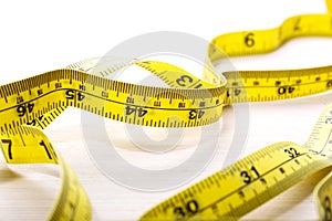 Measuring tape on table, close up