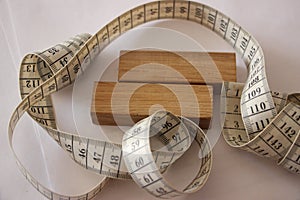 Measuring tape and wooden blocks. Healthcare concept