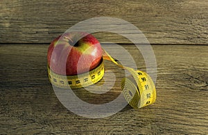 Measuring tape wrapped around an apple