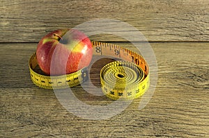 Measuring tape wrapped around an apple