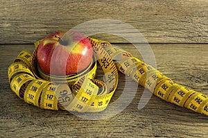 Measuring tape wrapped around an apple