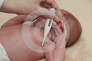 Measuring the temperature of baby in thermometer