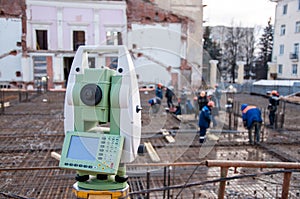 Measuring tool on a construction site. Geodesic equipment