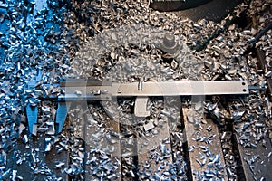 Measuring tool covered with metal shavings