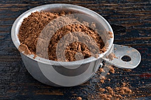 Measuring unprocessed healthy cocoa powder photo