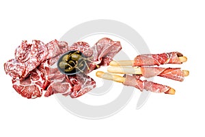 Meat appetizer platter with grissini sticks, Prosciutto crudo, Salami and Coppa Sausage and olives. Isolated, white