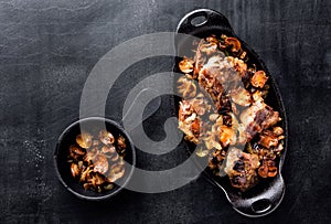 Meat baked with mushrooms and onions