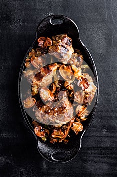 Meat baked with mushrooms and onions