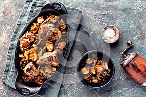 Meat baked with mushrooms and onions