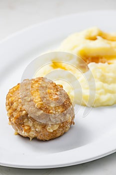 meat ball with cheese served with mashed potatoes