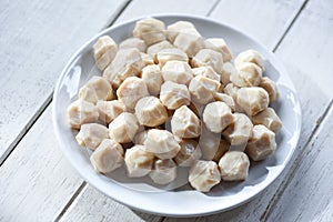 Meat ball on white plate and wooden background, meat ball with pork and ingredient for cooked asian thai food