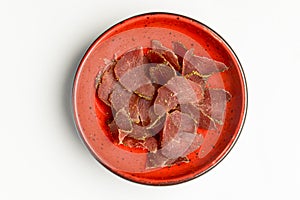 Meat bowl with carpaccio meat served over white background. Georgian cuisine concept