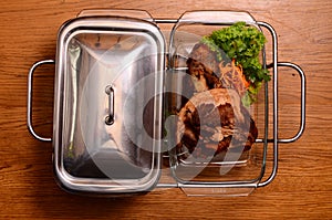 Potatoes and meat on a baking tray