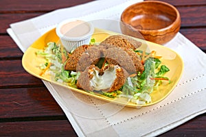 Meat Cheese Kubbe or Meat Cheese Kibbe with salad and dip served in dish isolated on table side view of middle east food photo