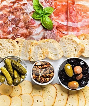 Meat and cheese snack set for wine on white background