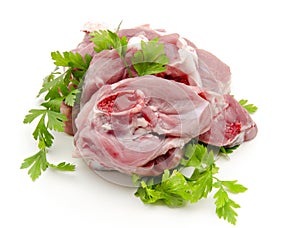 Chops raw goat meat