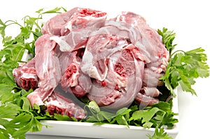 Chops raw goat meat
