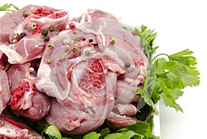 Chops raw goat meat