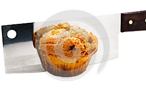 Meat cleaver cutting a cupcake