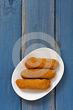 Meat croquete on plate