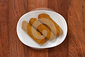 Meat croquete on plate