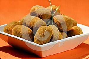 meat croquette in white bowl