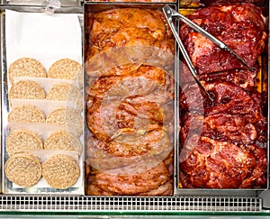 Meat in cutlets on the counter in the market. Semifinished