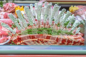 Meat department, lamb chops exposed for sale