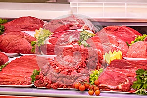 Meat department, showcase with variety of meat in different cuts