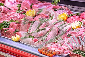 Meat department, showcase with variety of meat in different cuts