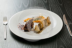 Meat dish with vegetables on the plate