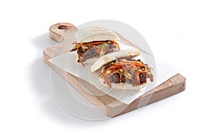 Korean baos on wooden board photo