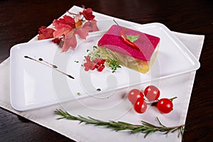 Meat galantine with vegetables, beautiful decoration aspic for festive meal