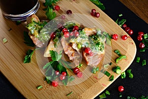 Meat with greens and berries and wine. Meat on a wooden board